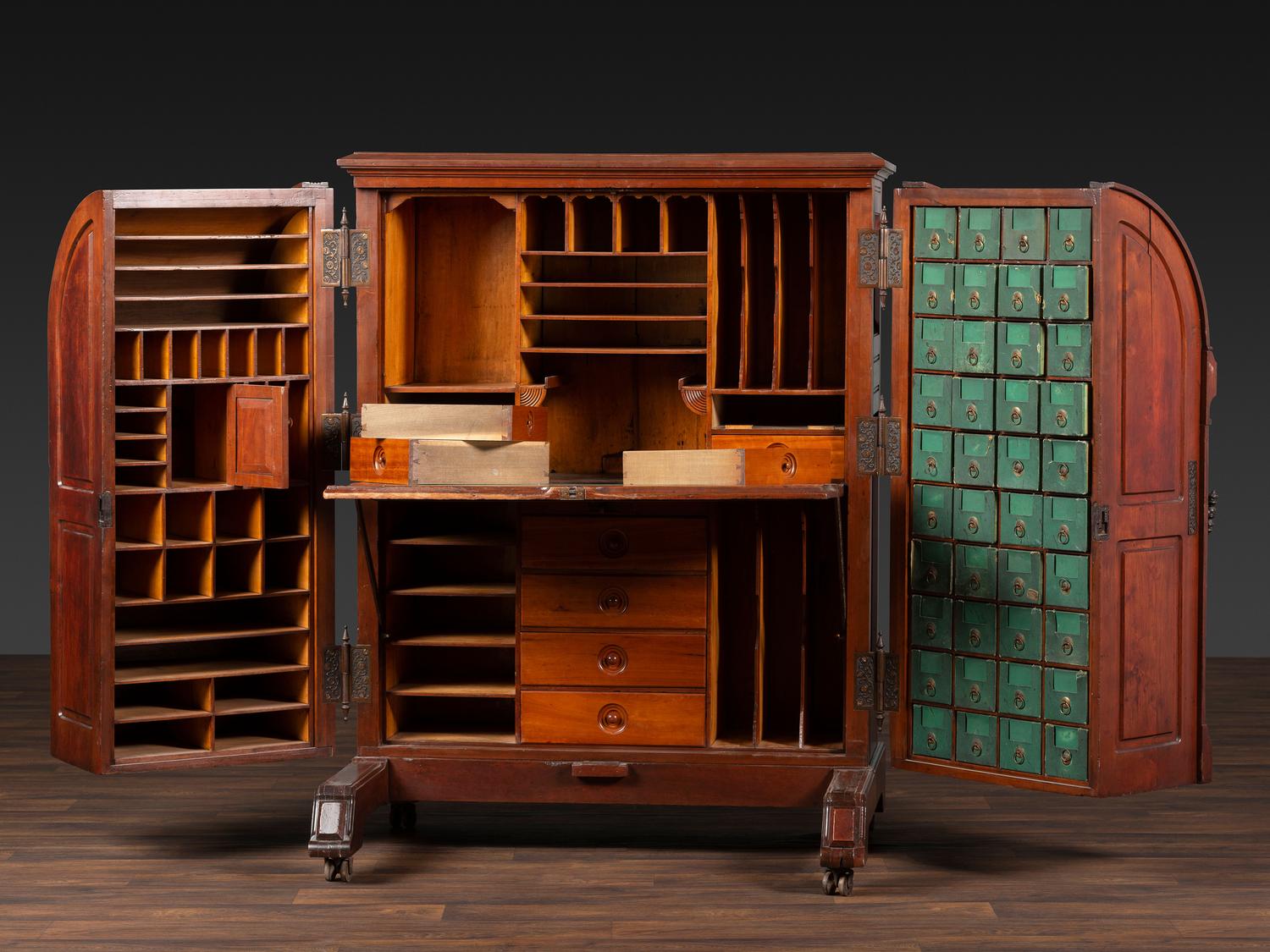 A Carved Walnut Wooton Secretary Desk