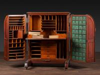 A Carved Walnut Wooton Secretary Desk