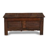 An English Carved and Paneled Oak Coffer
