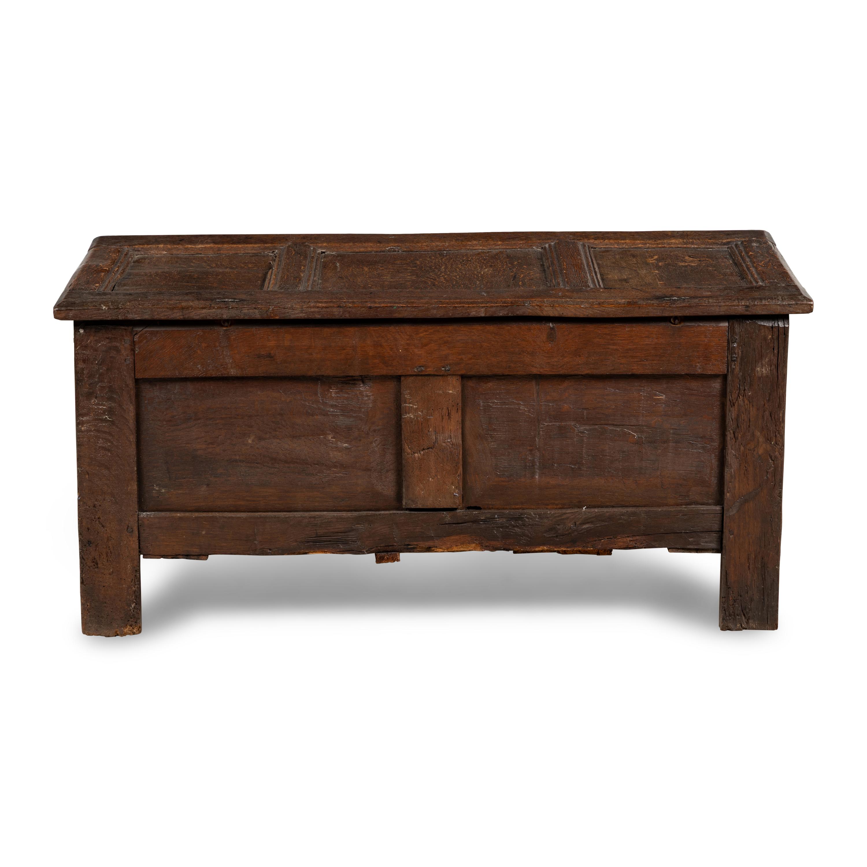 An English Carved and Paneled Oak Coffer