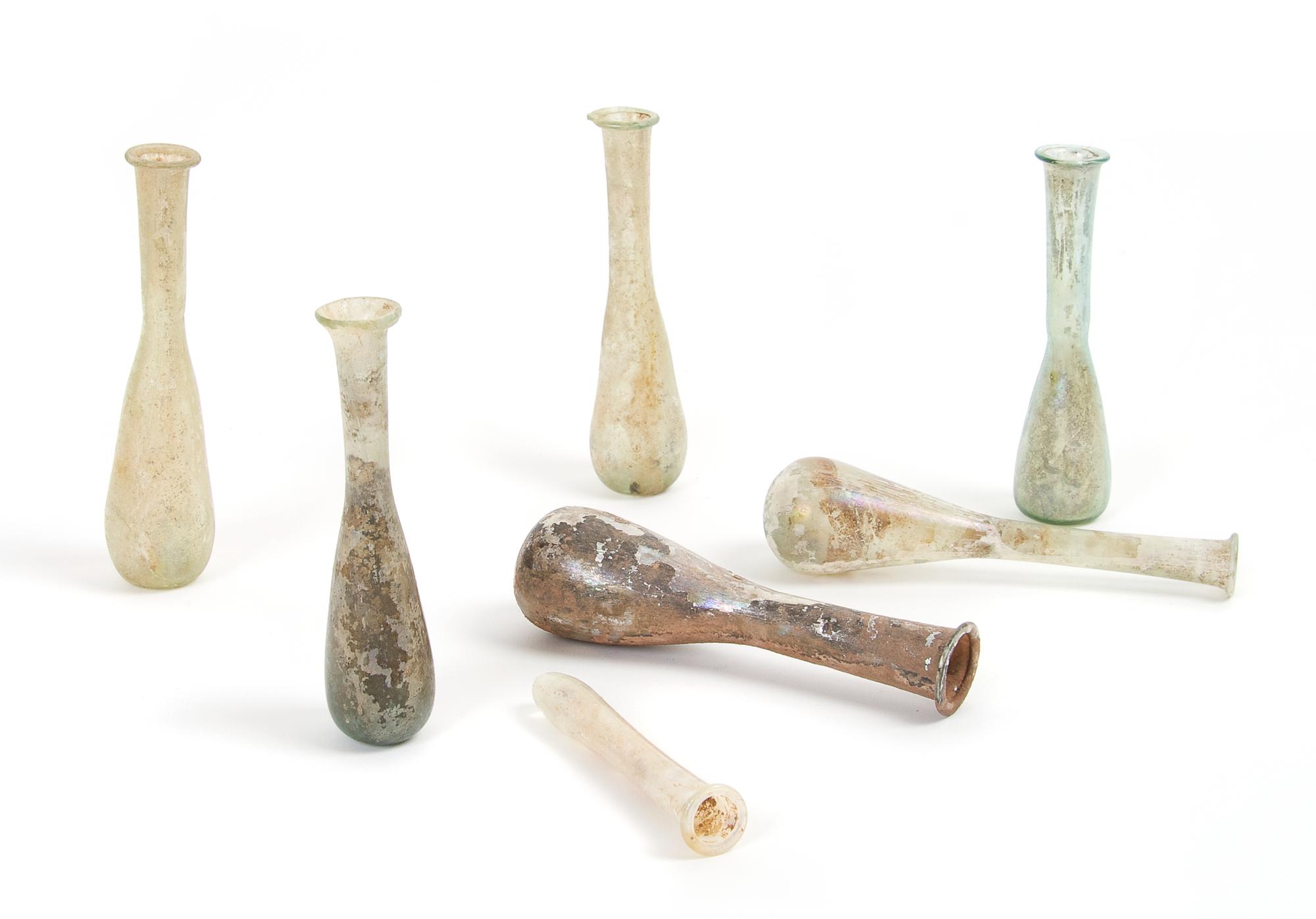 A Collection of Seven Roman Glass Unguentariums, Height of tallest 4 3/4 inches.