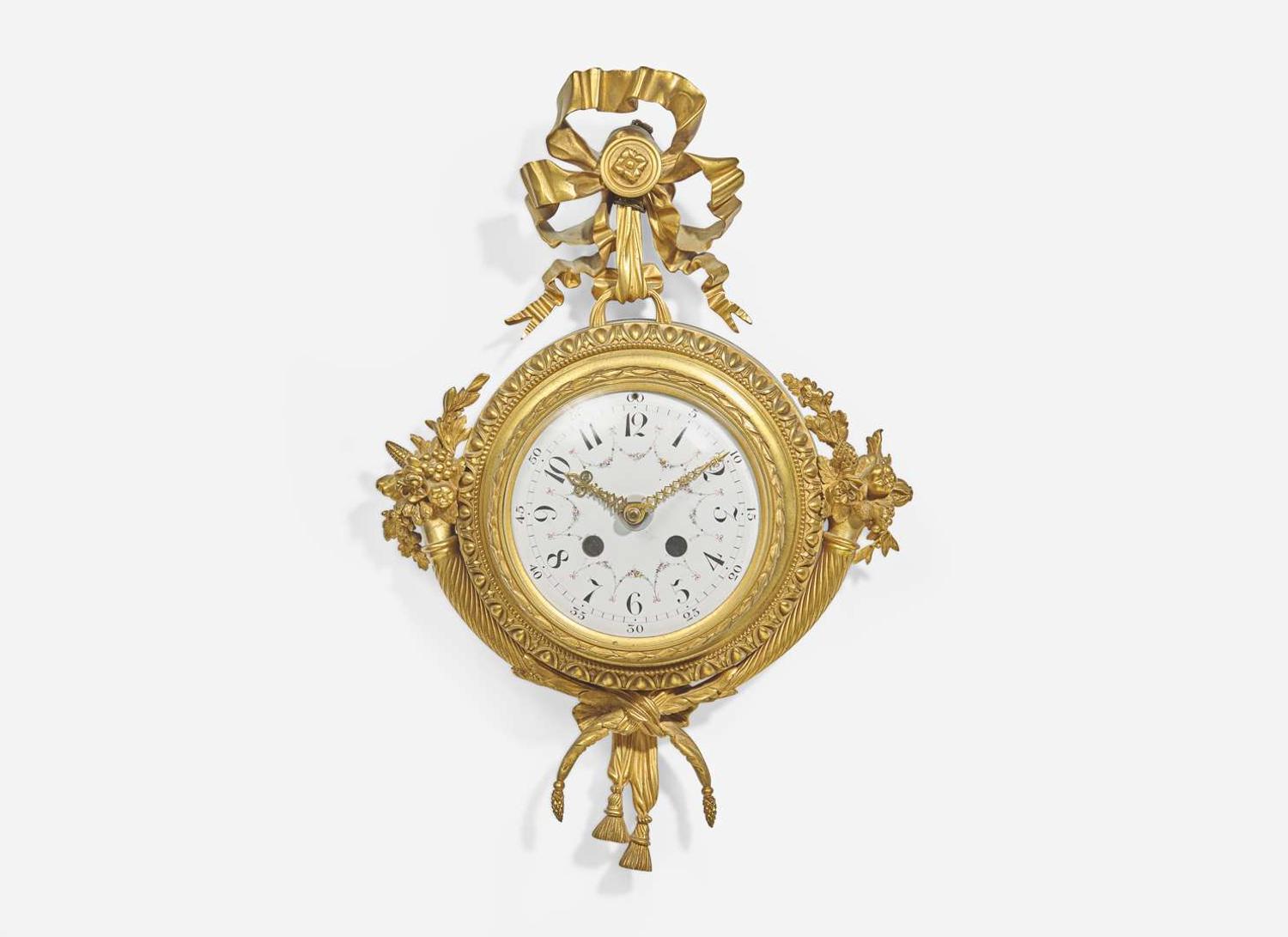 A Louis XVI Style Gilt Bronze and Enameled Porcelain Cartel Clock