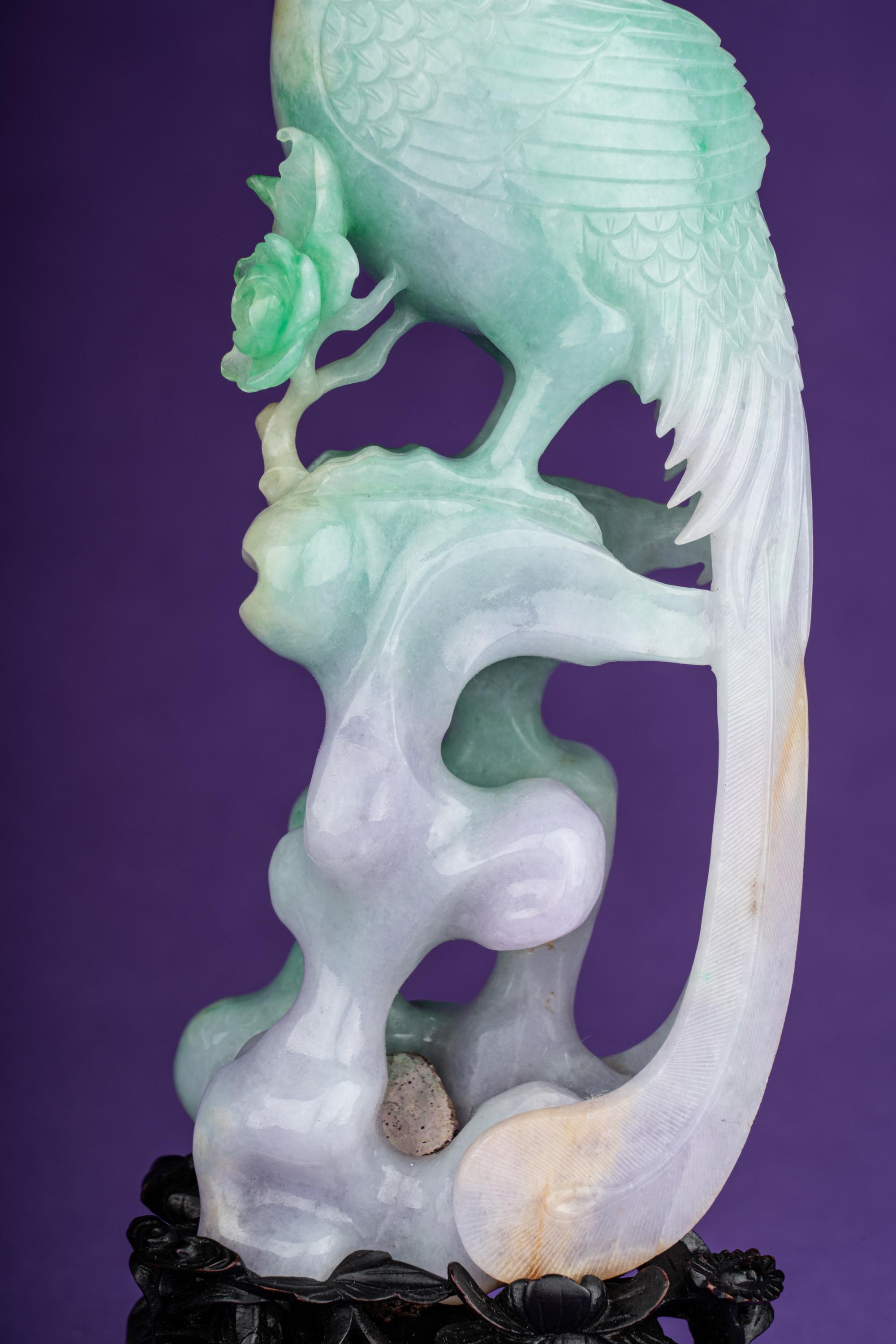 A Pair of Semi-Translucent Green Jadeite Figures of Phoenix