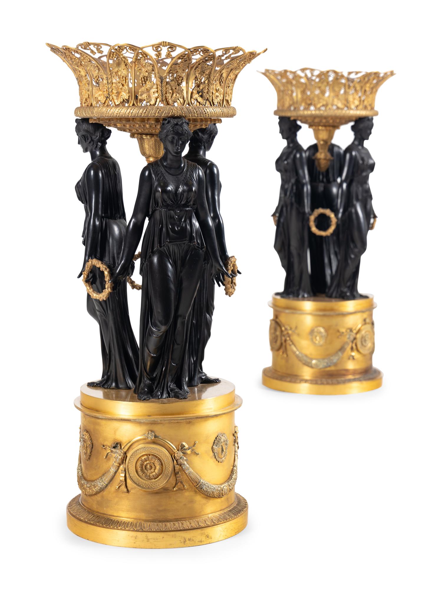 A Pair of Empire Style Gilt and Patinated Bronze Figural Centerpieces