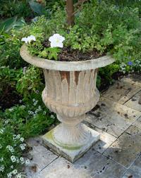 Four Campana Form Painted Iron Jardinieres on Plinth Bases