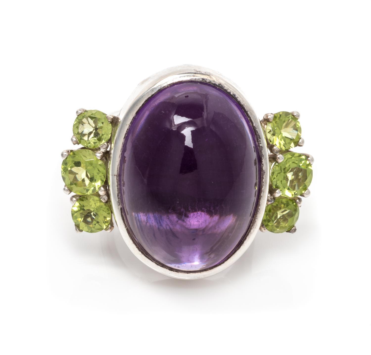 A Silver, Amethyst and Peridot Ring, 17.95 dwts.