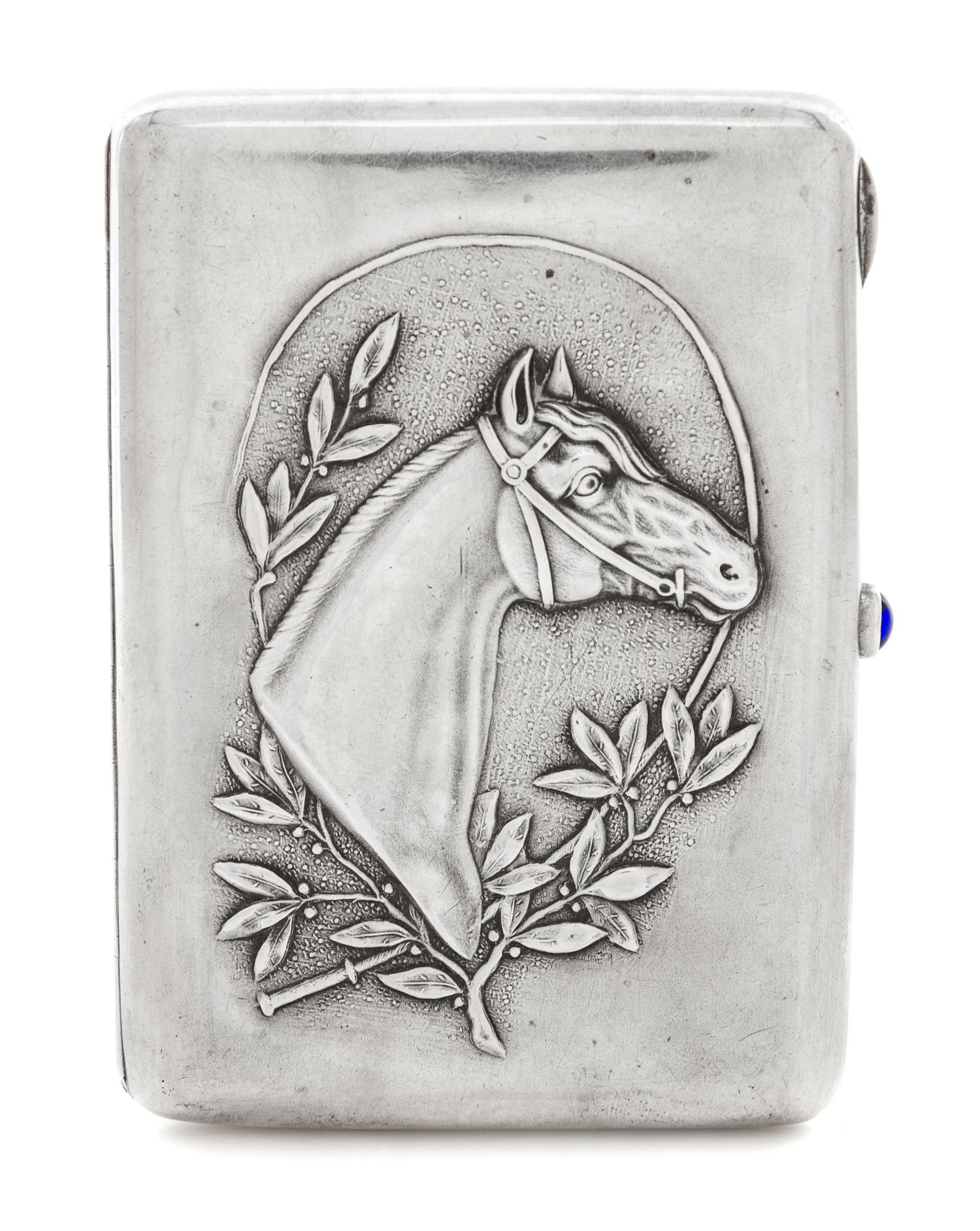 A Russian Silver Cigarette Case, Maker's mark Cyrillic DS, Moscow, the case worked to show the profile of a throughbred horse bordered