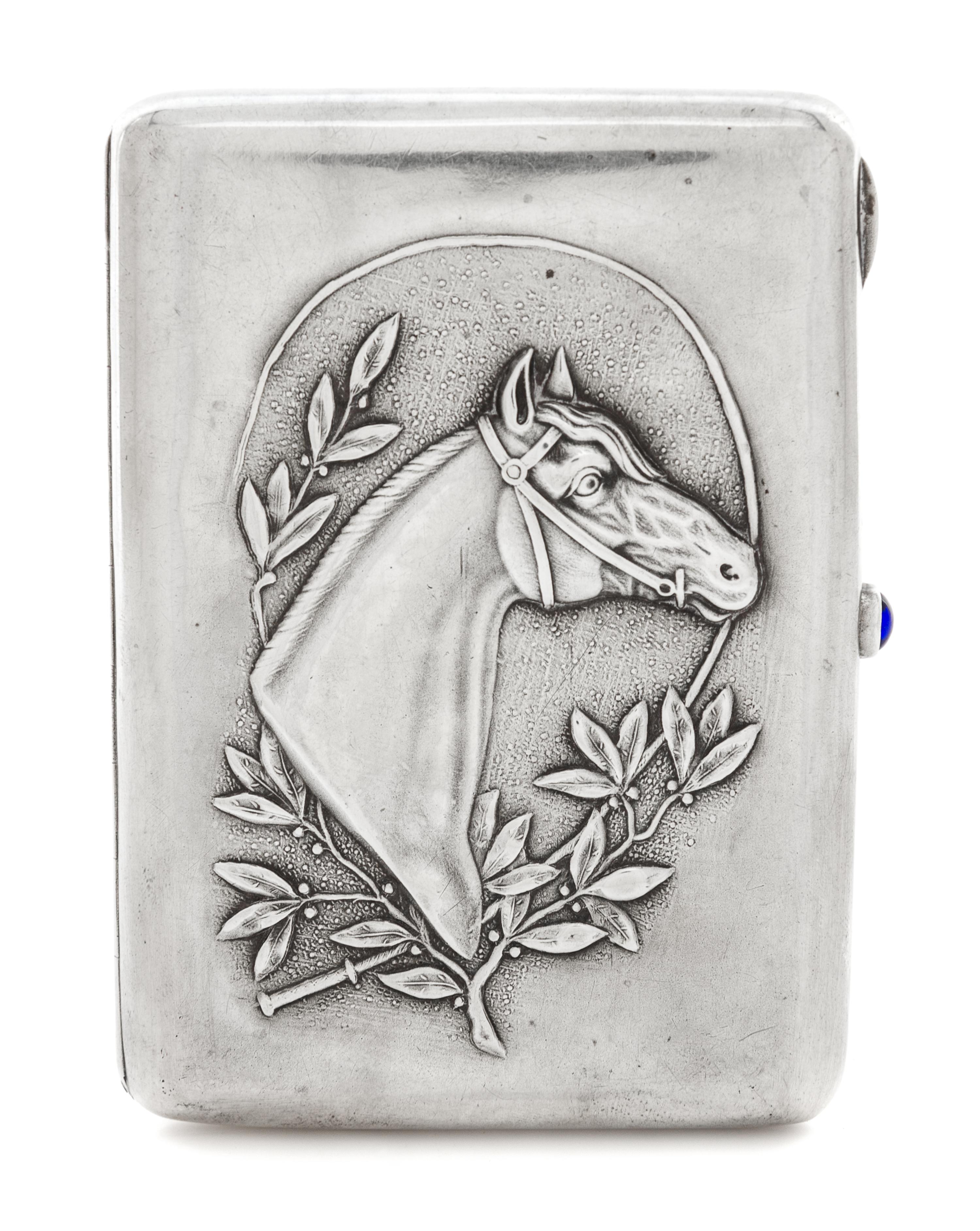 A Russian Silver Cigarette Case, Maker's mark Cyrillic DS, Moscow, the case worked to show the profile of a throughbred horse bordered
