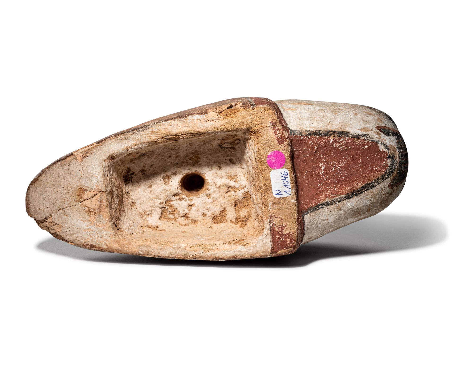 An Egyptian Polychrome Wood Head of a Lion