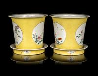 A Pair of Chinese Yellow Ground Famille Rose Cache Pots and Undertrays