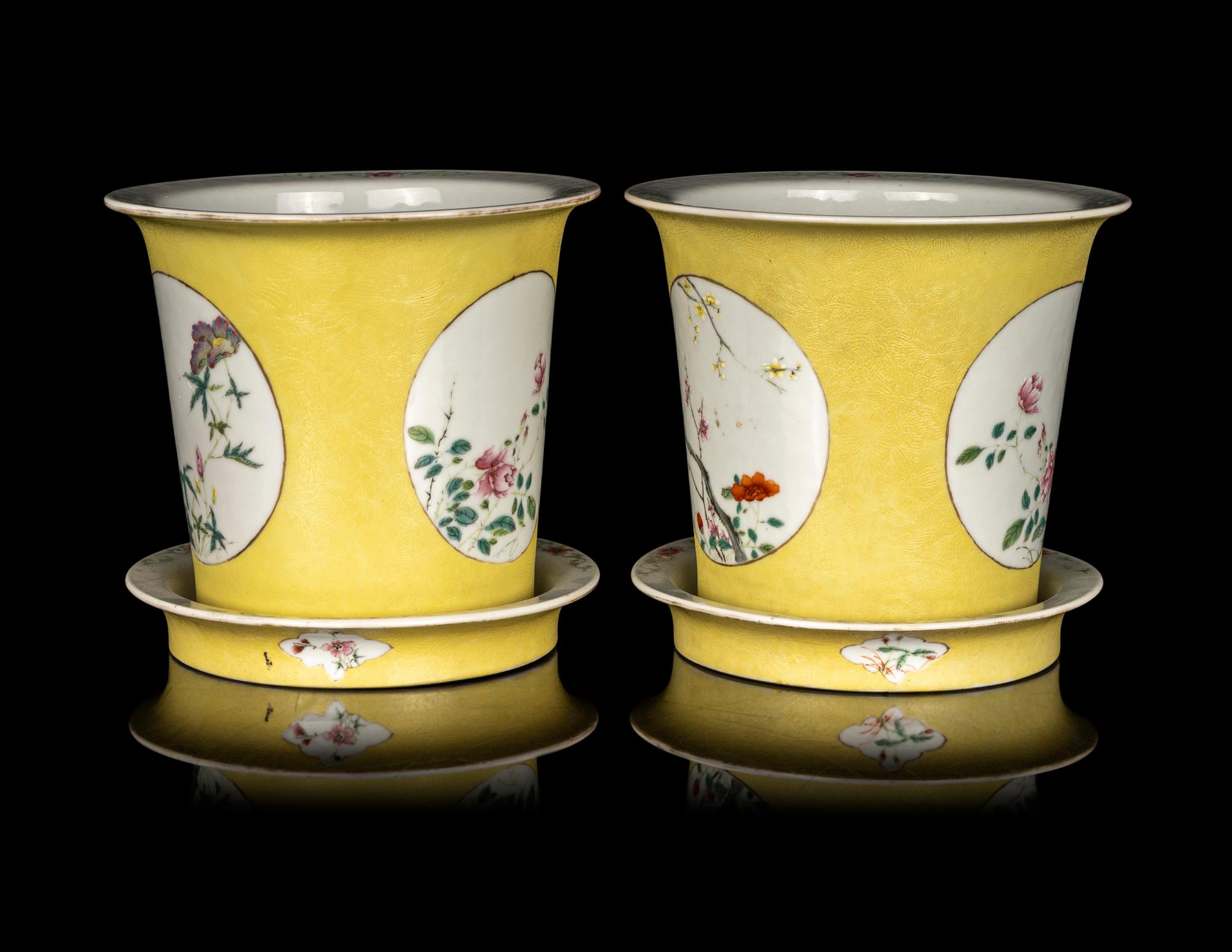 A Pair of Chinese Yellow Ground Famille Rose Cache Pots and Undertrays