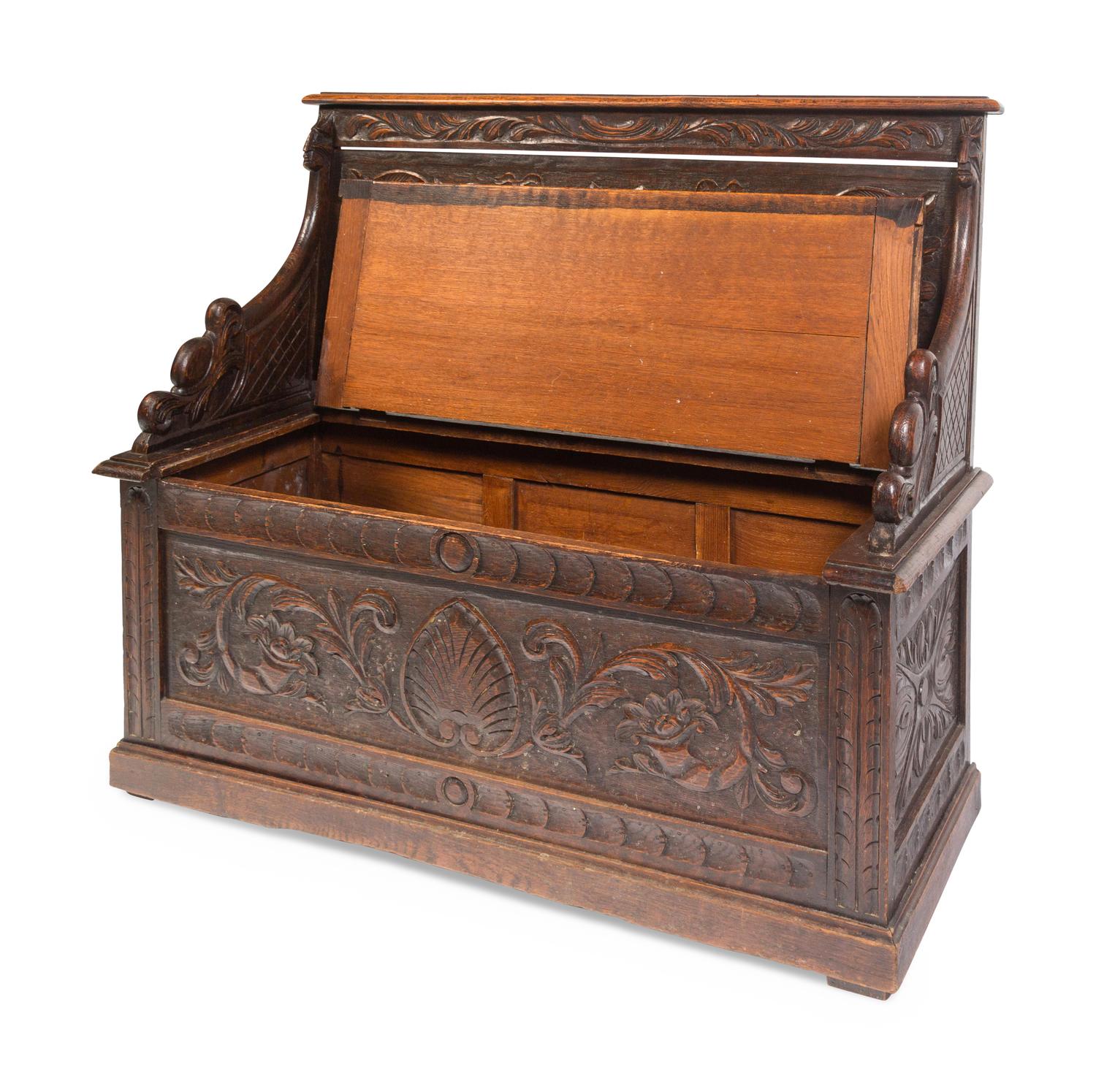 An Italian Renaissance Revival Carved Oak Settle