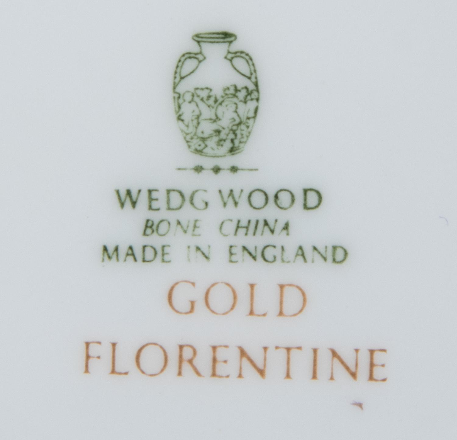 A Wedgwood Gold Florentine Porcelain Dinner Service