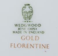 A Wedgwood Gold Florentine Porcelain Dinner Service