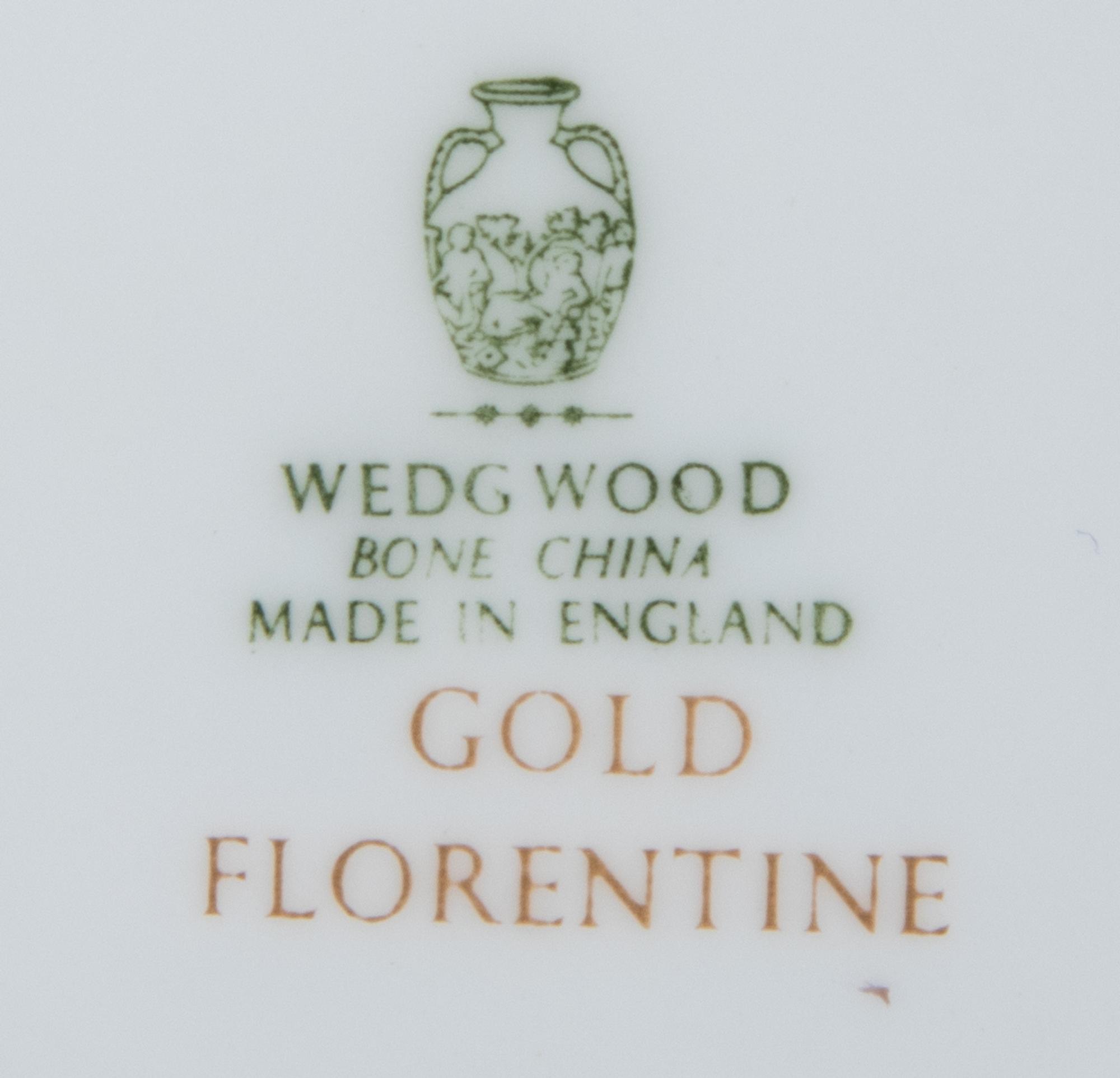 A Wedgwood Gold Florentine Porcelain Dinner Service