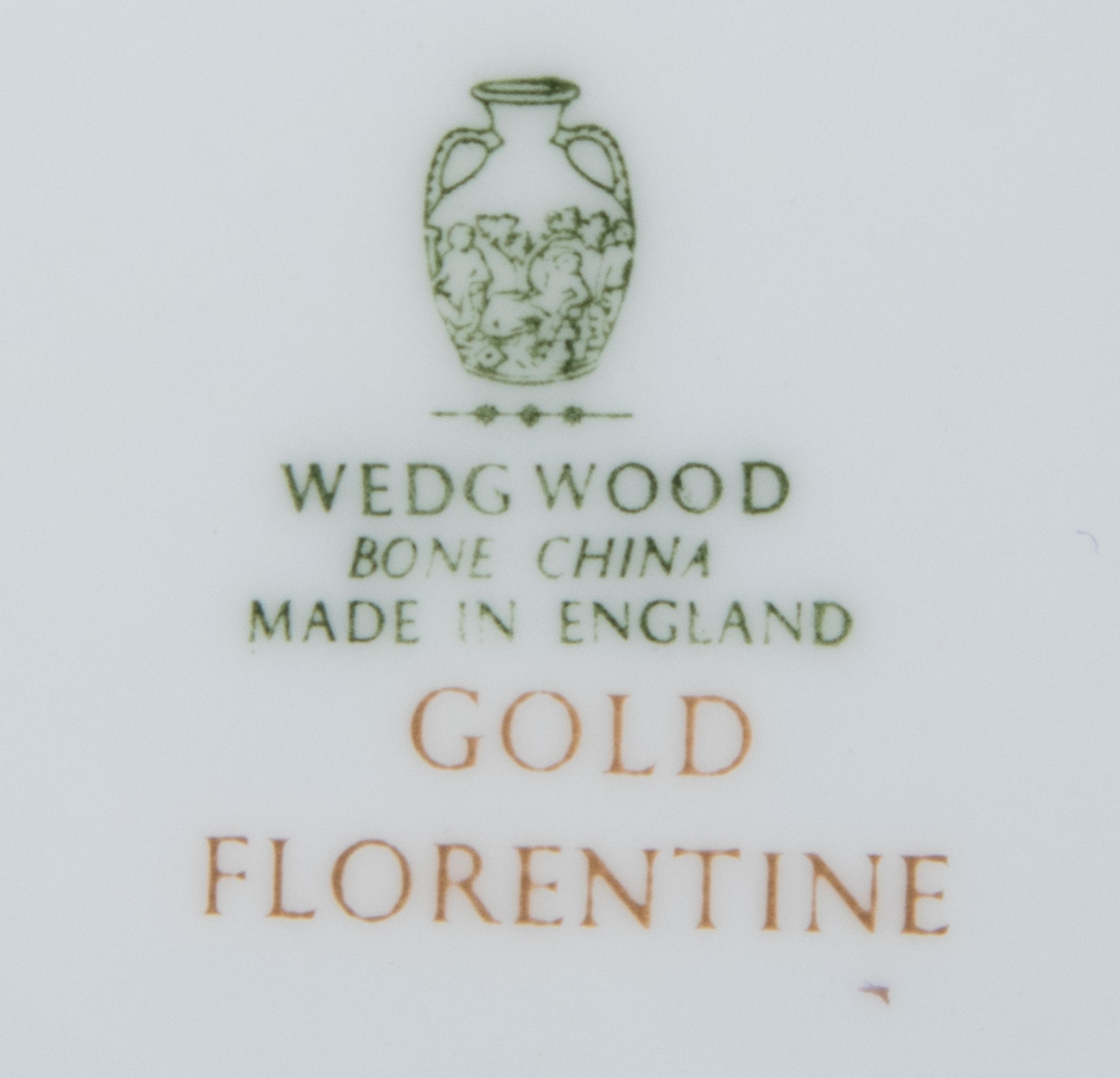 A Wedgwood Gold Florentine Porcelain Dinner Service