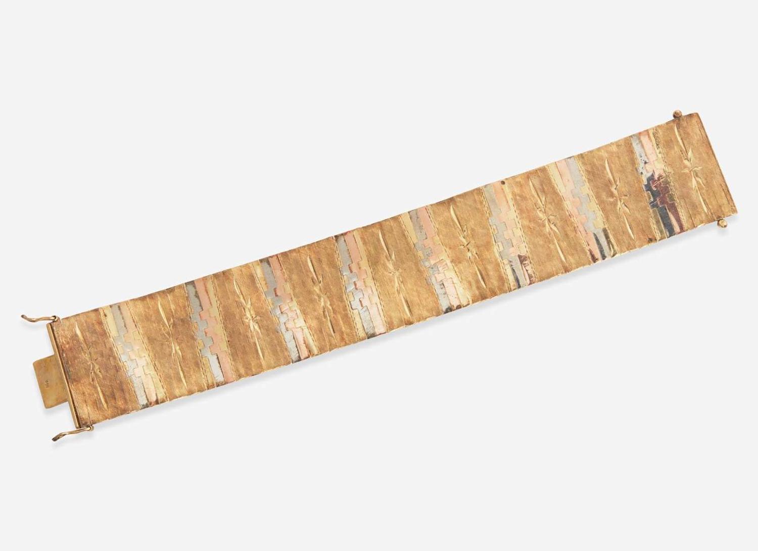 A Ladies Tri-Color 14K Gold Bracelet