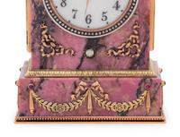 A Carved Hardstone, Enamel, 14-Karat Gold and Hardstone Mounted Three-Piece Clock Garniture