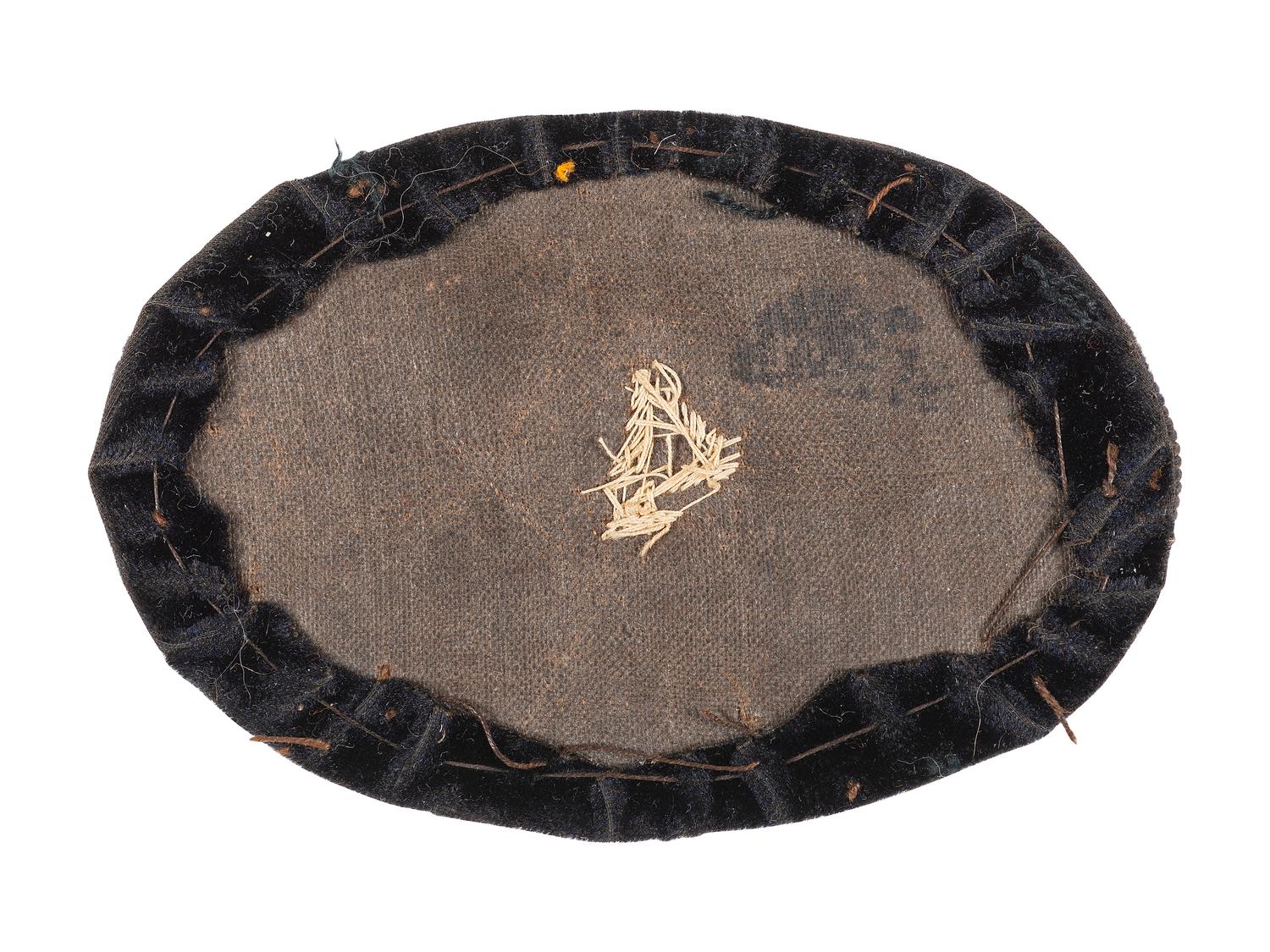 Civil War artillery hat insignia with regimental number "4."