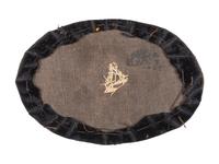 Civil War artillery hat insignia with regimental number "4."