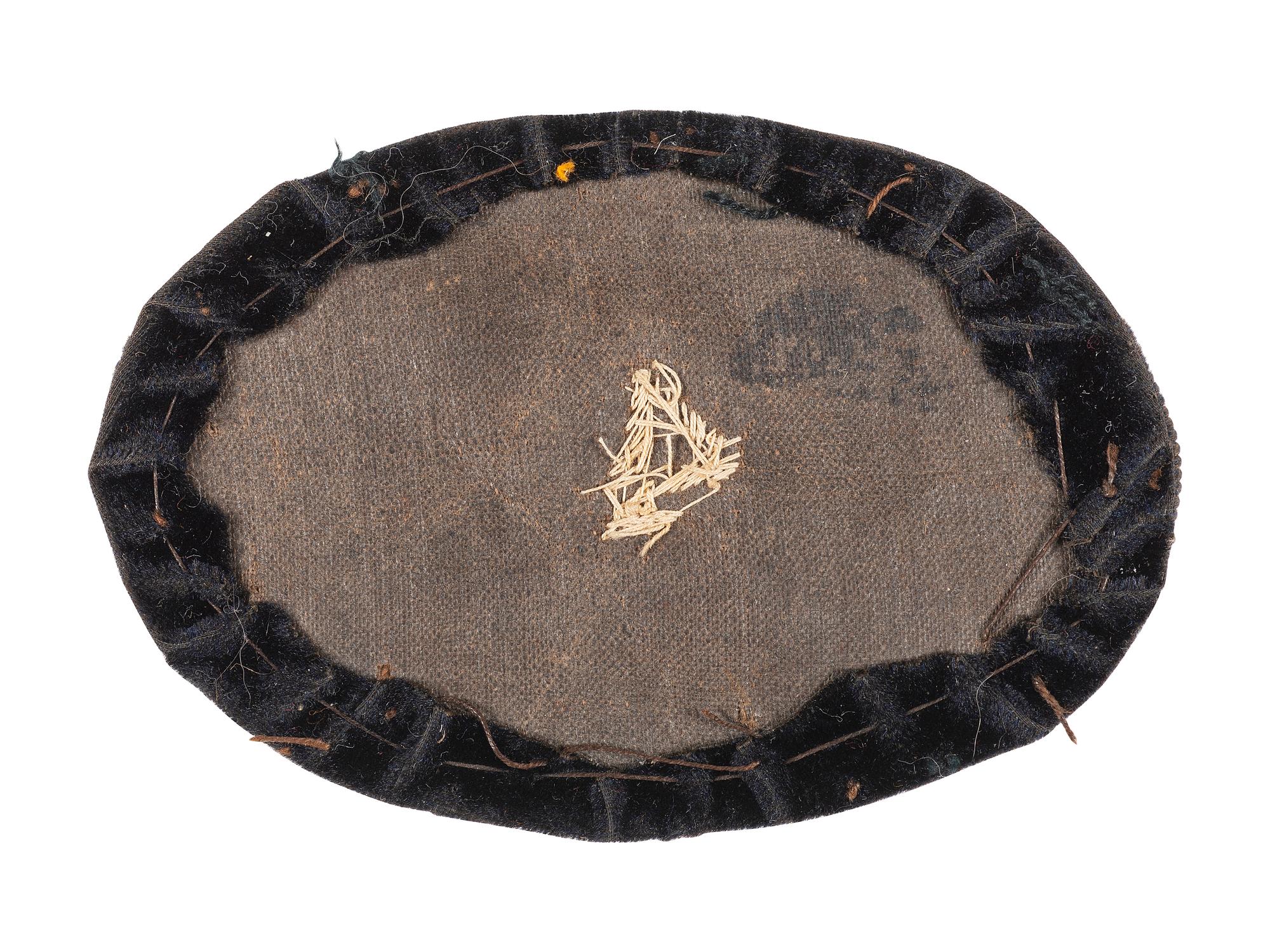 Civil War artillery hat insignia with regimental number "4."