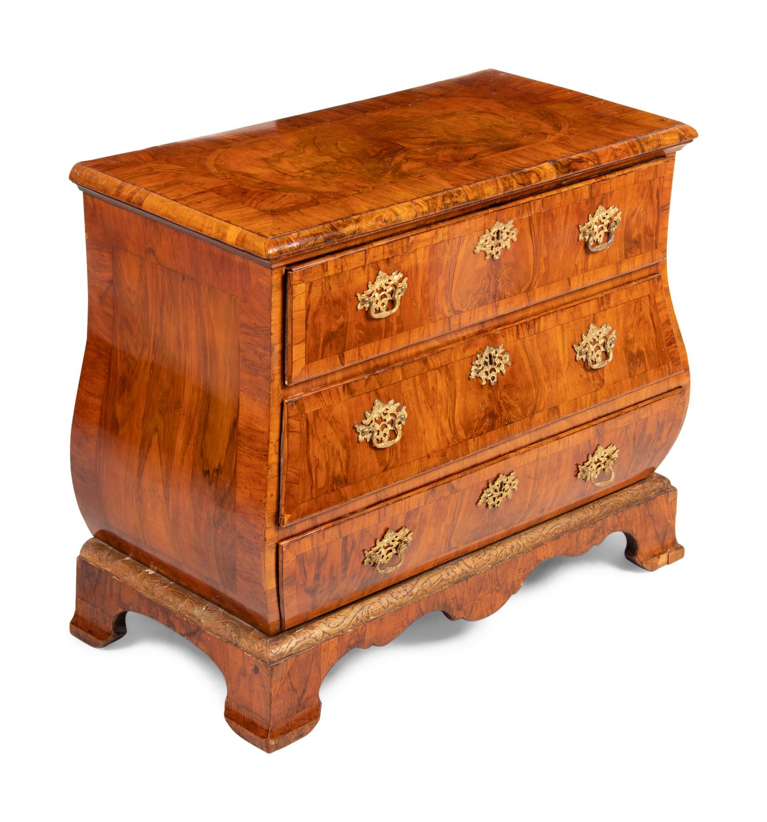A German Gilt Bronze Mounted and Parcel Gilt Burl Walnut Bombe Chest in the Louis XV Taste
