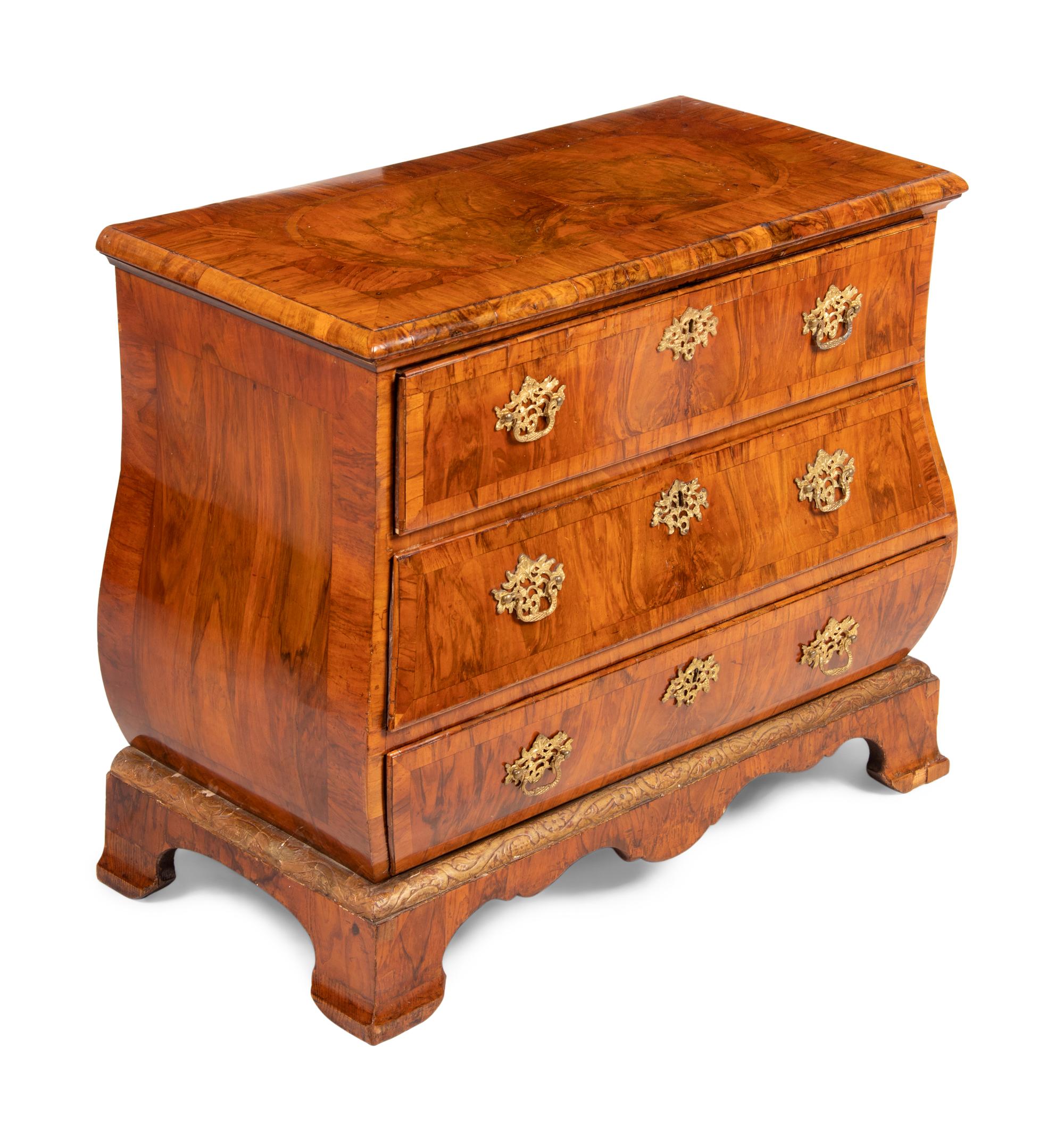 A German Gilt Bronze Mounted and Parcel Gilt Burl Walnut Bombe Chest in the Louis XV Taste