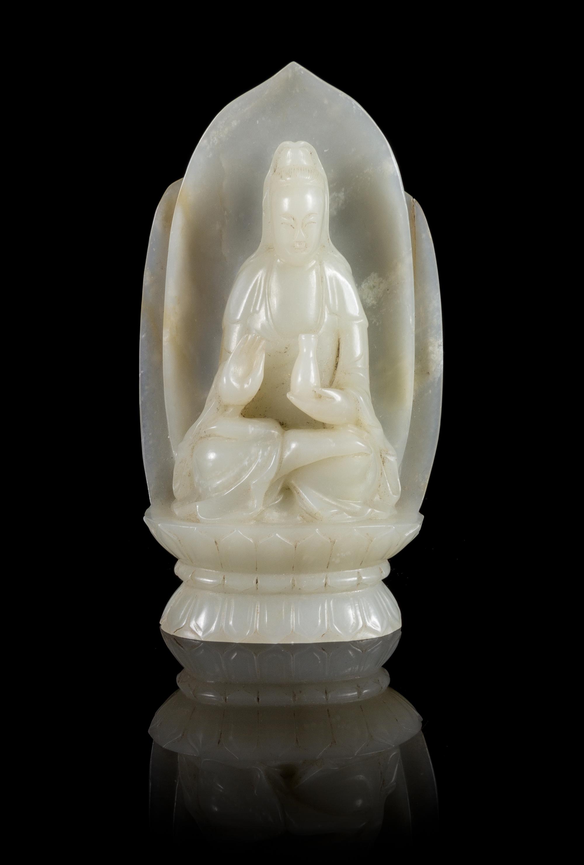 A Near-White Jade Figure of Guanyin Height 4 3/4 inches.