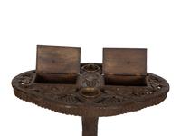 A Swiss Black Forest Carved Wood Smoking Table