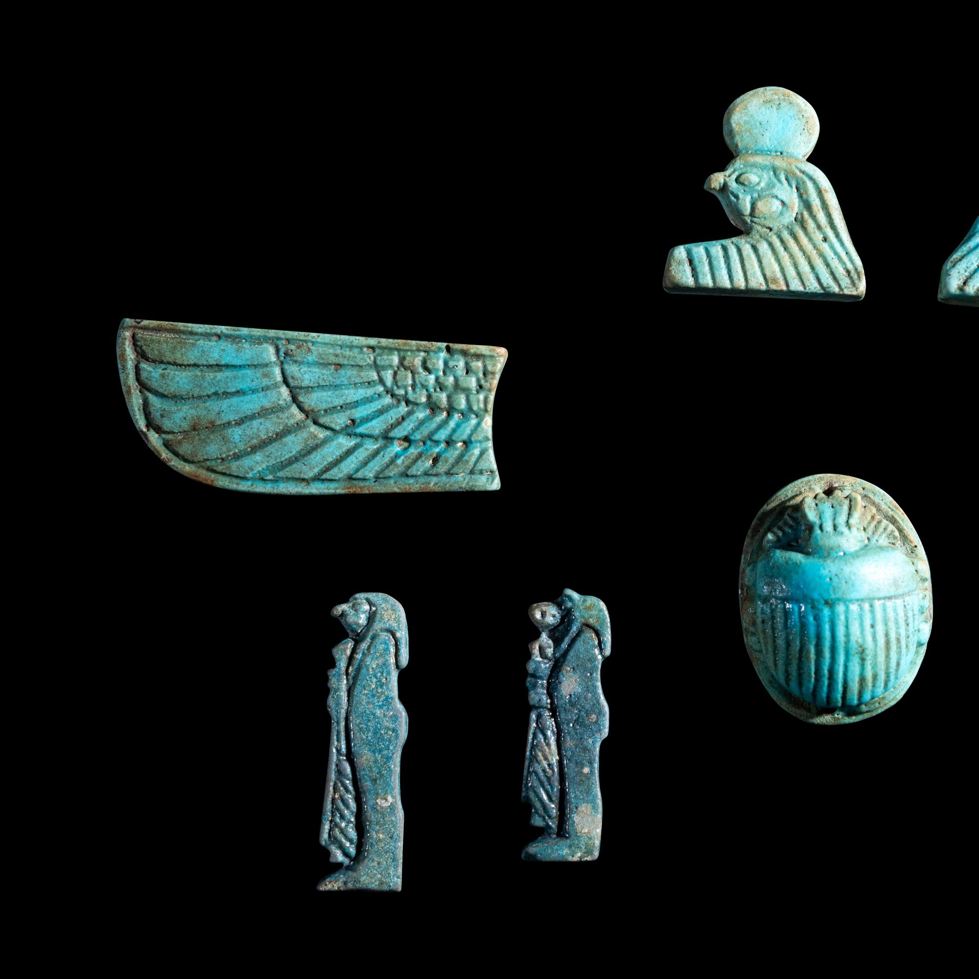 An Egyptian Faience Winged Scarab Set