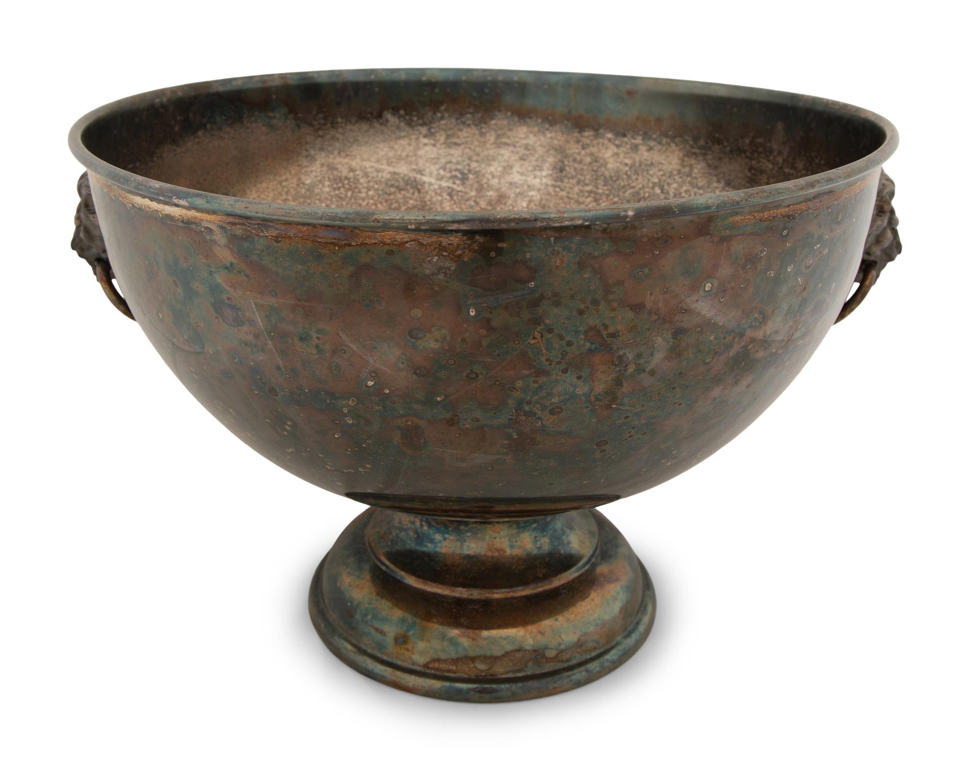 An Assembled Trio of Silverplate Footed Punch Bowls with Lionhead Handles