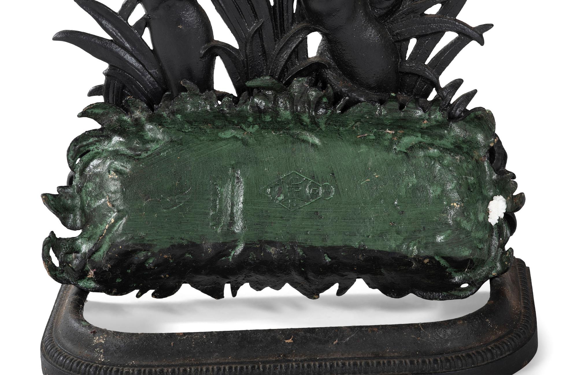 A Cast Iron Putto and Serpent Umbrella Stand