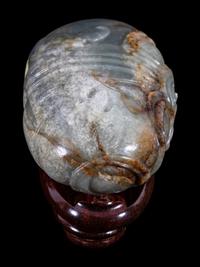 A Grey and Russet Jade Purse-Form Paperweight