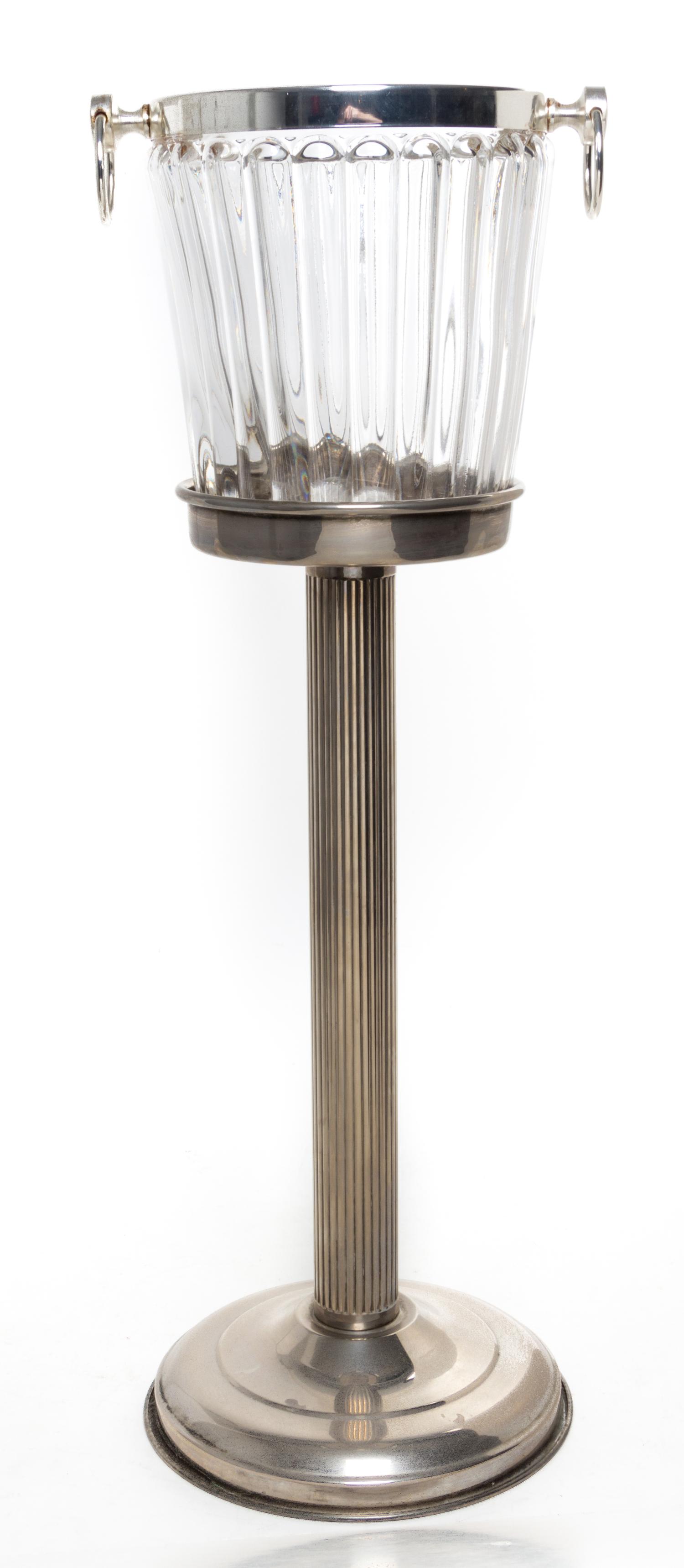 A Silver-plate and Molded Glass Wine Cooler on Stand Height 28 3/4 inches.