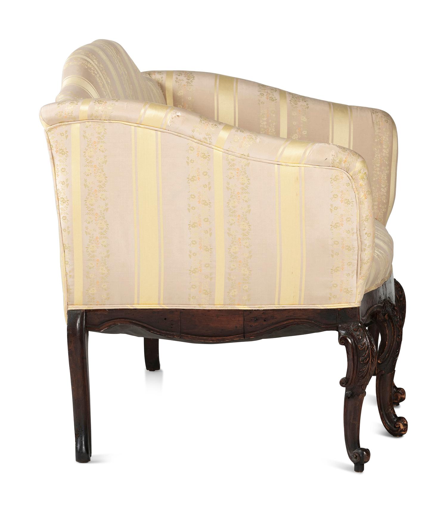 An Italian Carved and Black Painted Walnut Upholstered Sofa