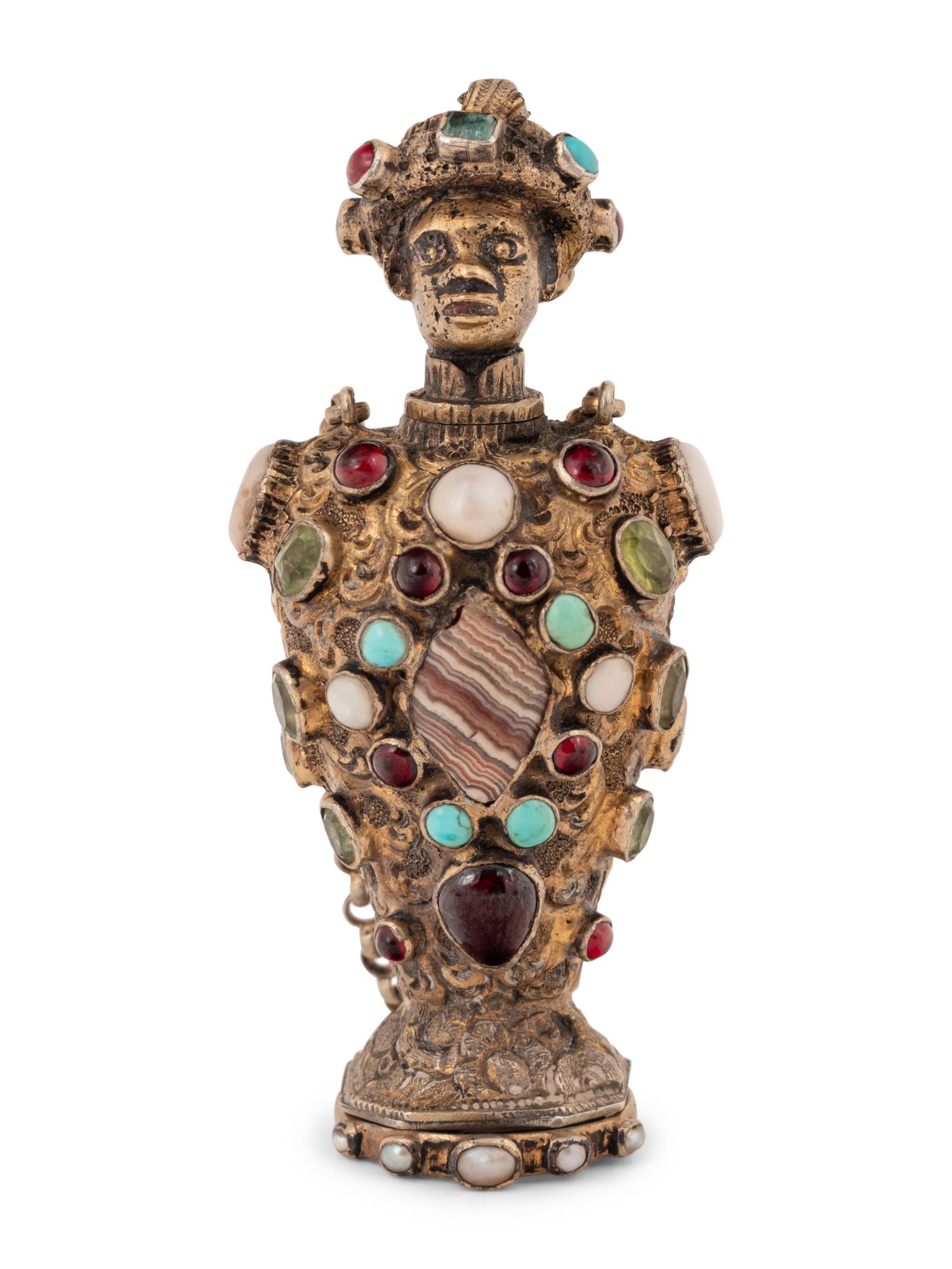 A Continental Jeweled Silver Figural Scent Bottle and Hand Seal