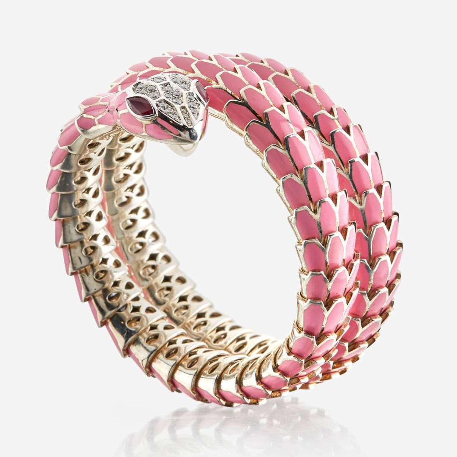 An enamel, white gold plated sterling silver, diamond, and ruby bangle