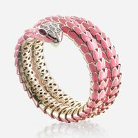 An enamel, white gold plated sterling silver, diamond, and ruby bangle