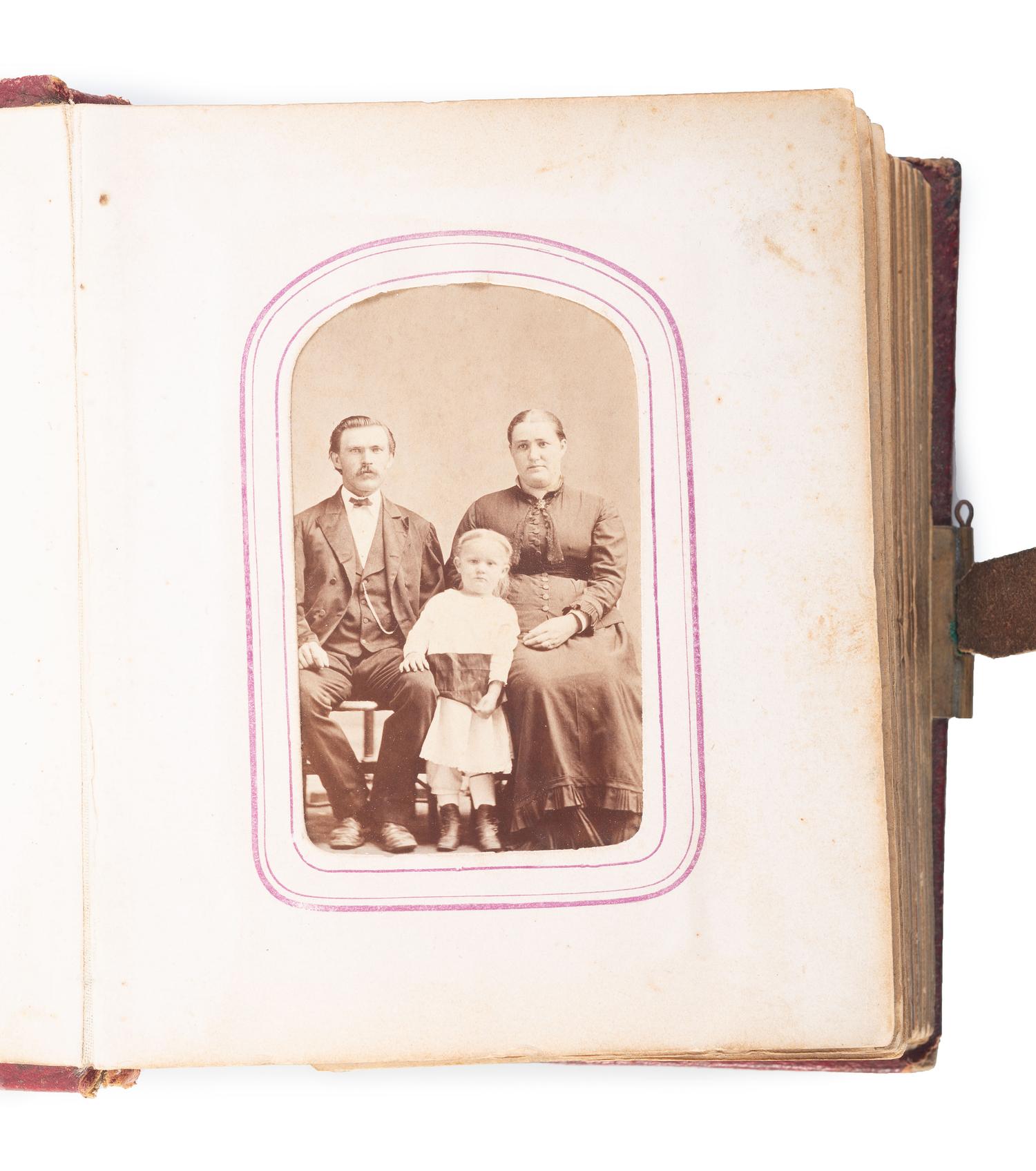 [EARLY PHOTOGRAPHY]. CDV album containing CDV of African American man and Caucasian woman.