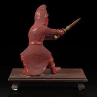An unusual and finely-carved cinnabar lacquer figure of a warrior 朱漆武士像