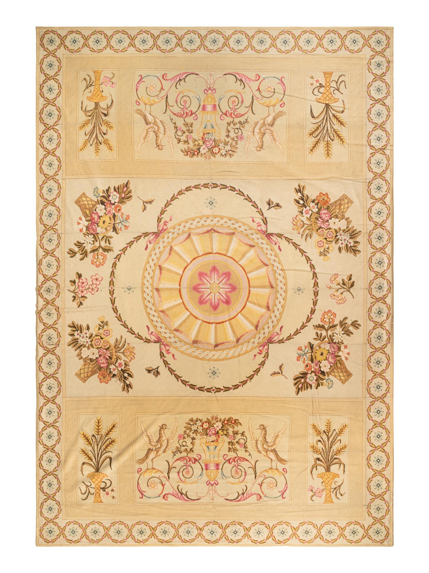 A Large Needlepoint Wool Rug