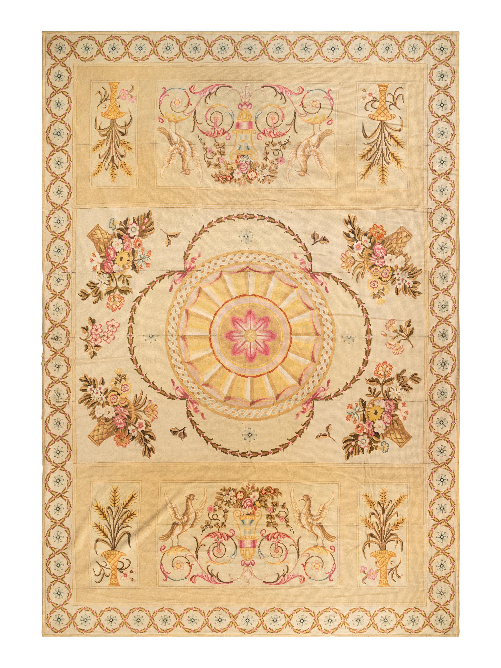 A Large Needlepoint Wool Rug