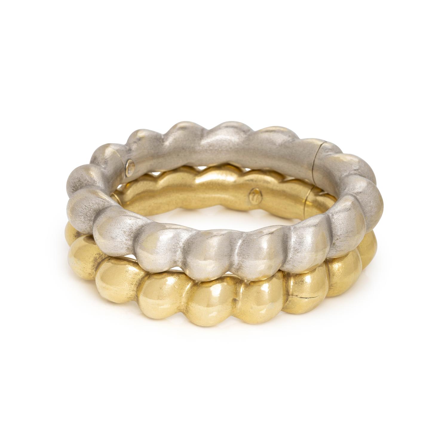 PAIR OF WHITE AND YELLOW GOLD BANGLE BRACELETS