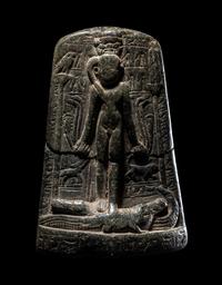 An Egyptian Black Stone Cippus of Horus