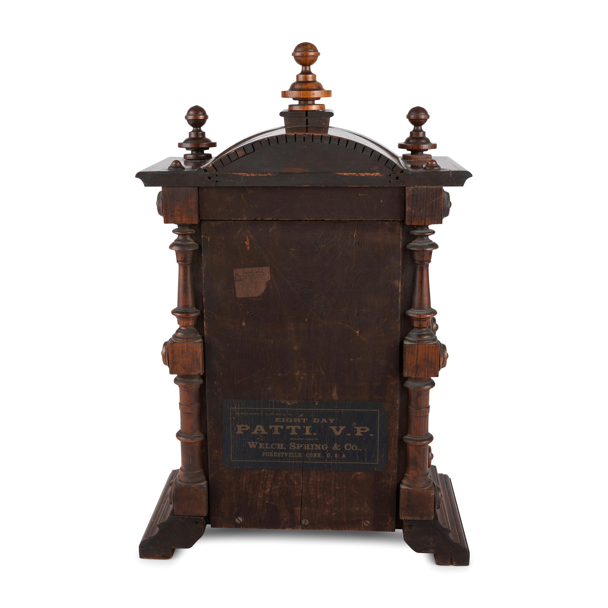 A Carved Rosewood Welch 'Patti VP' Shelf Clock