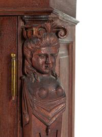 A Renaissance Revival Carved Walnut Tall Case Clock