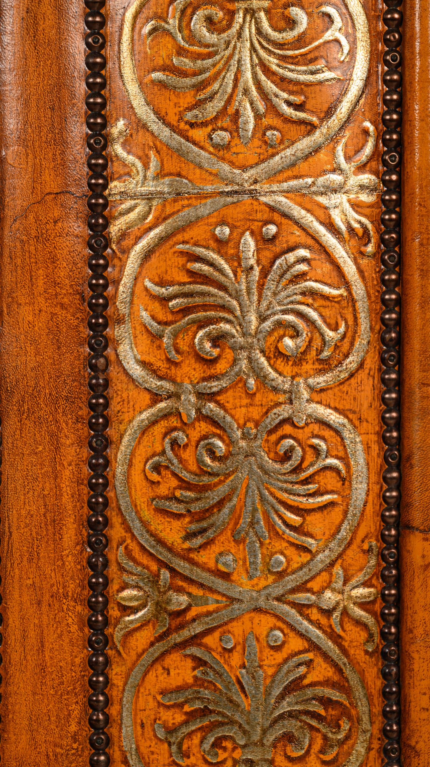 A Gilt Decorated Leather Mirror