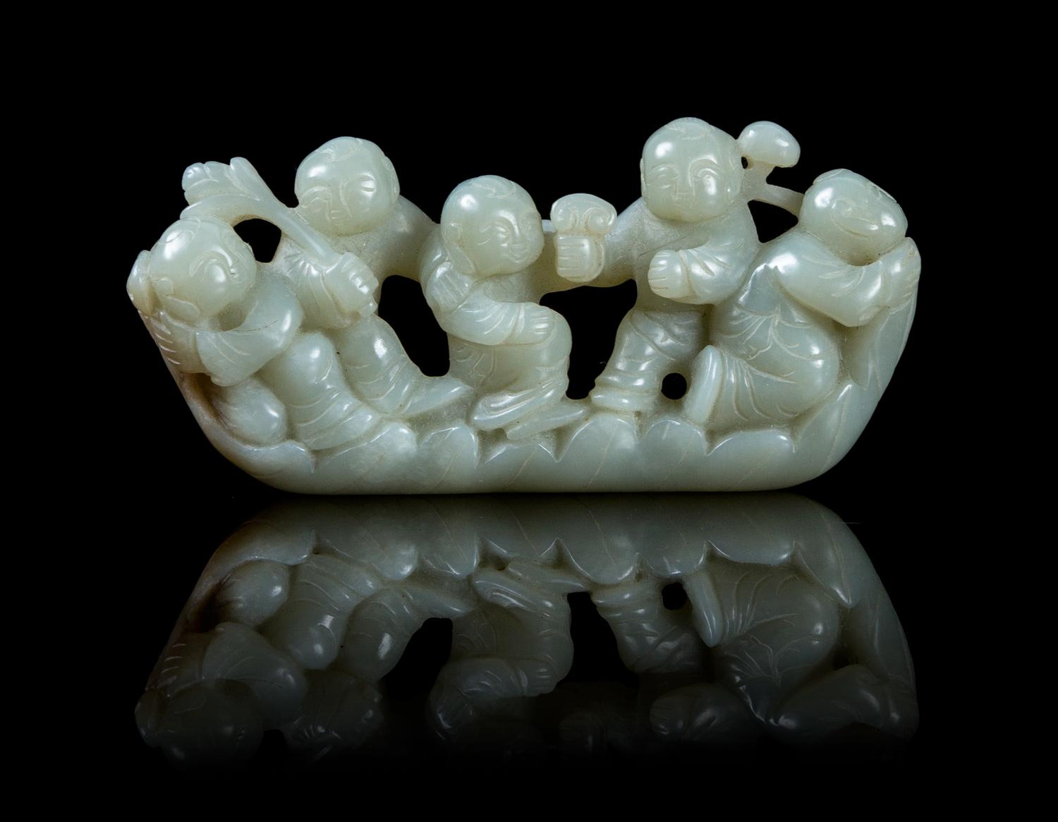 A Carved Jade Figural Group Length 4 inches.