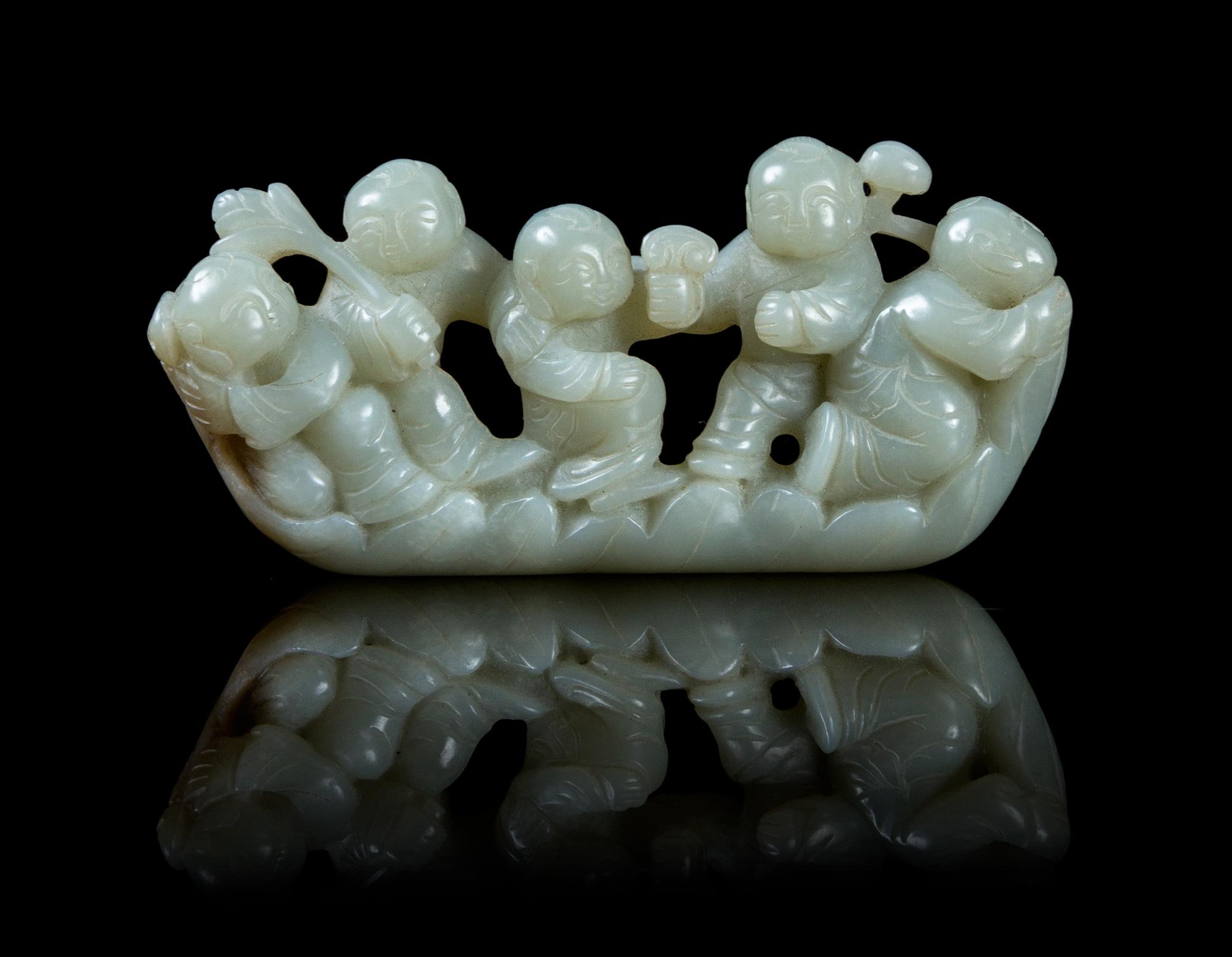 A Carved Jade Figural Group Length 4 inches.