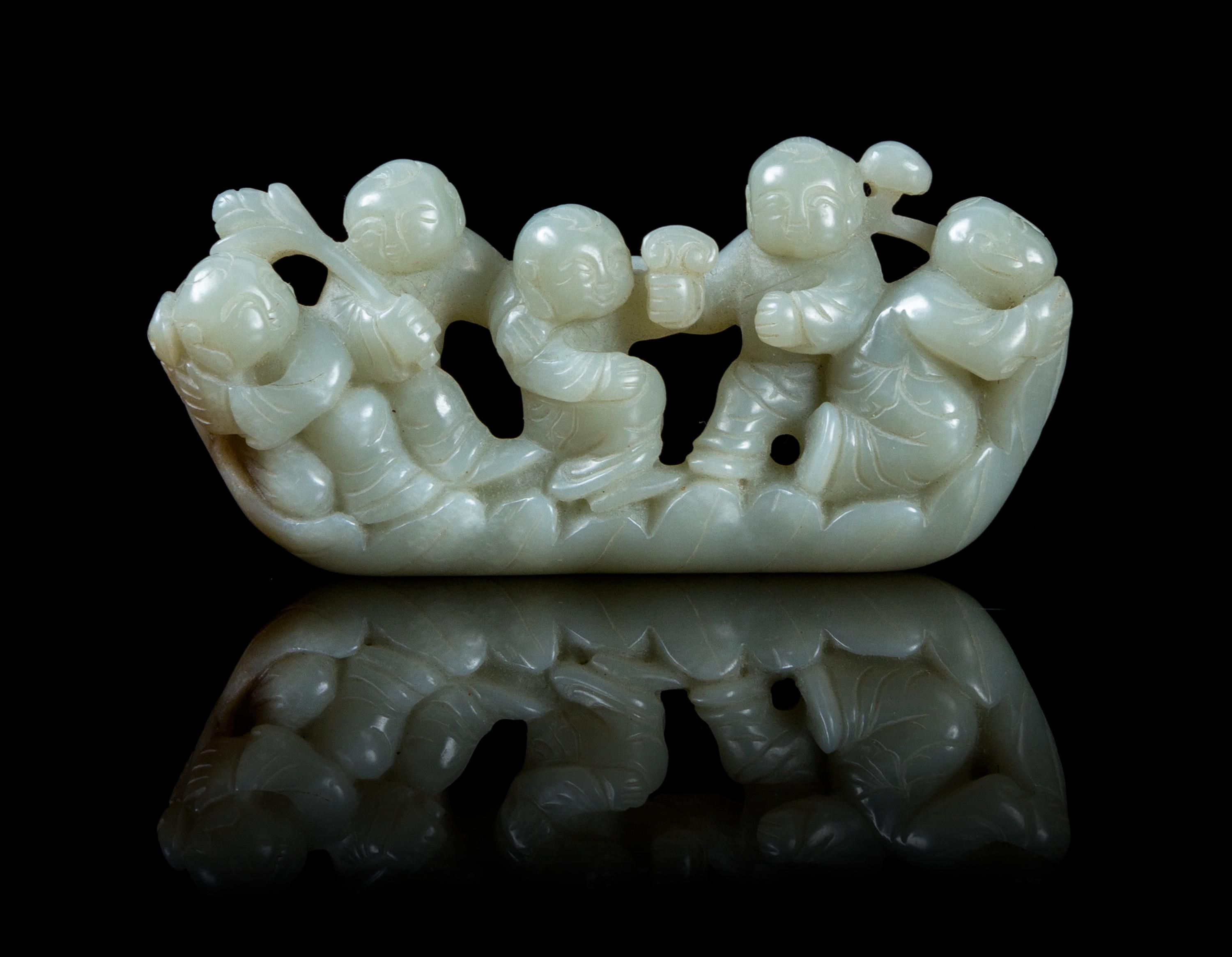 A Carved Jade Figural Group Length 4 inches.
